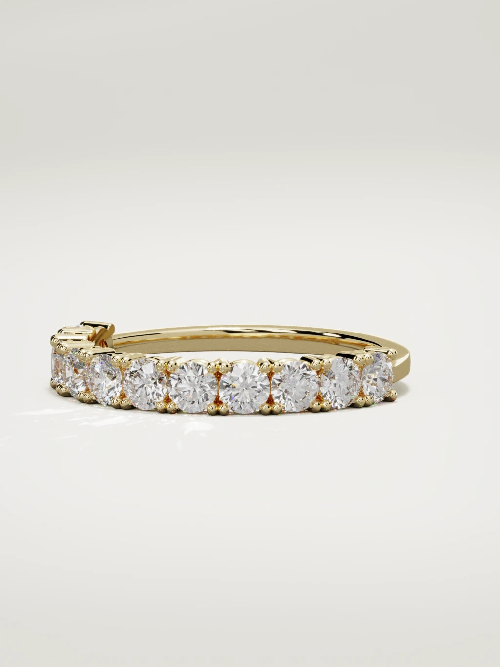 The Gloria open-prong half eternity band in 14K yellow gold, three-quarter view