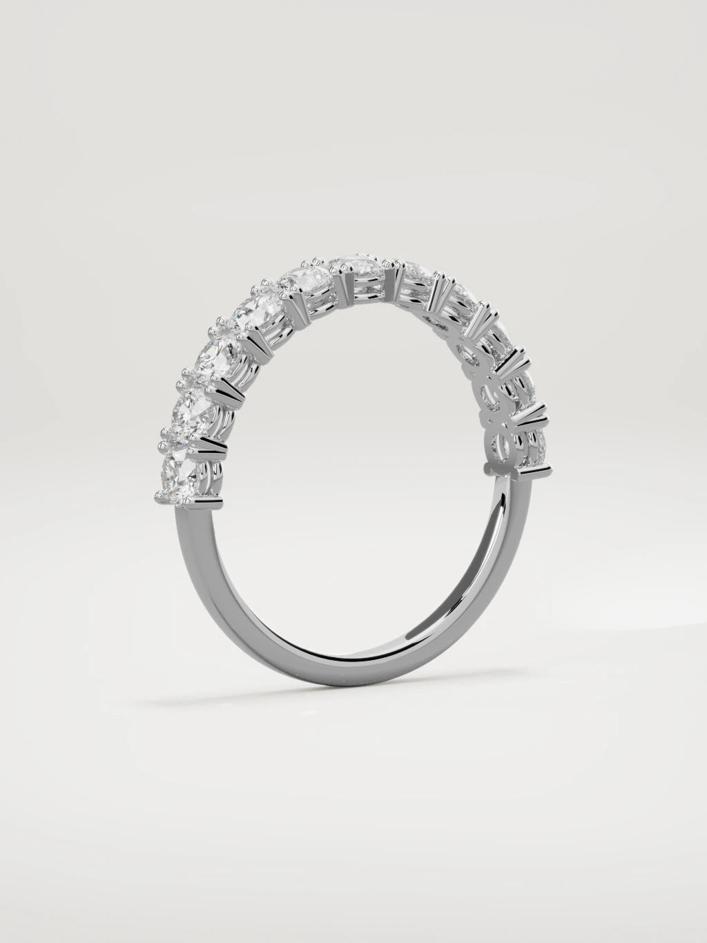 The Gloria open-prong half eternity band in 14K white gold, standing three-quarter view