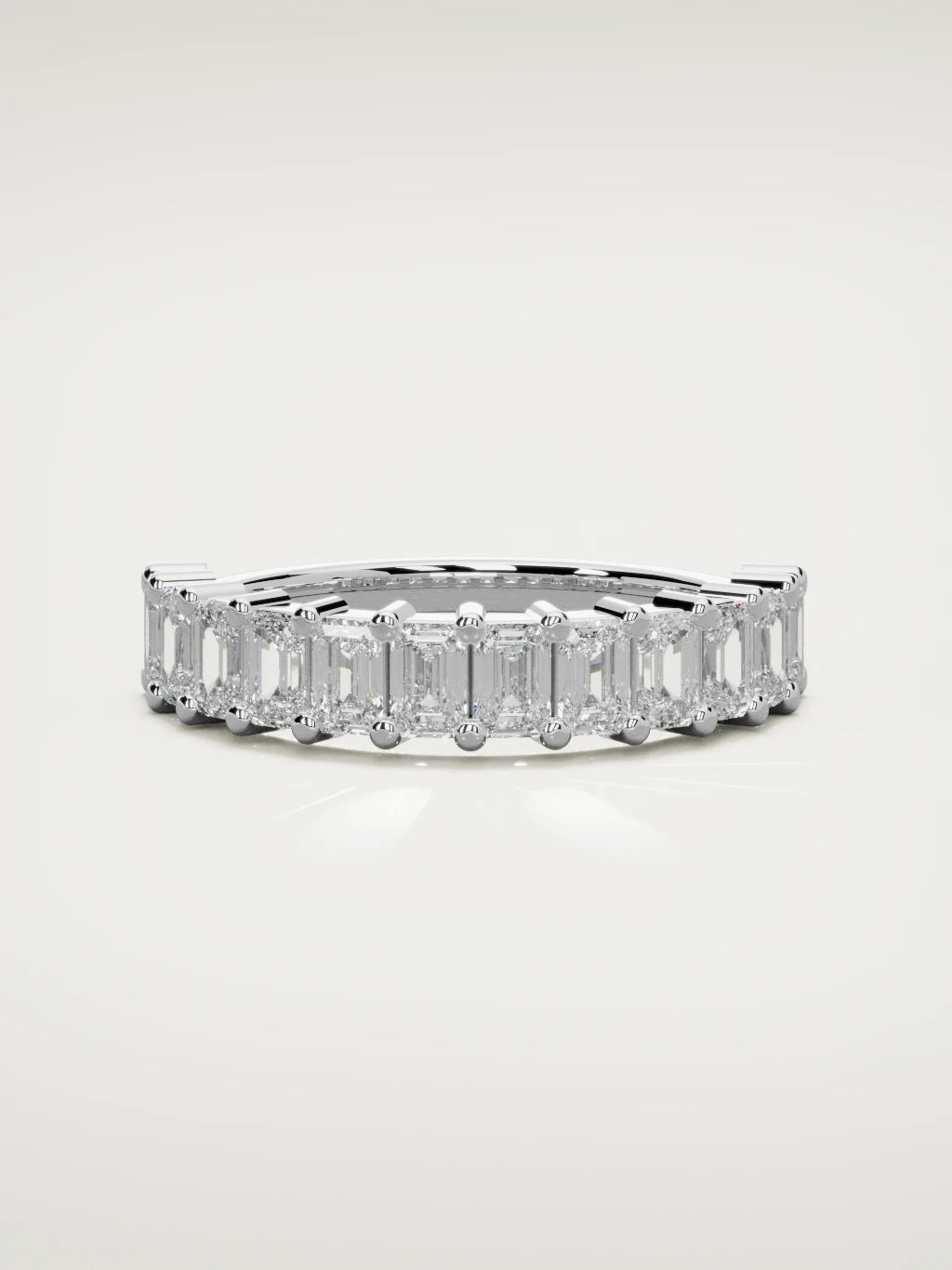 The Gracia prong emerald-cut half eternity band in 14K white gold, front view