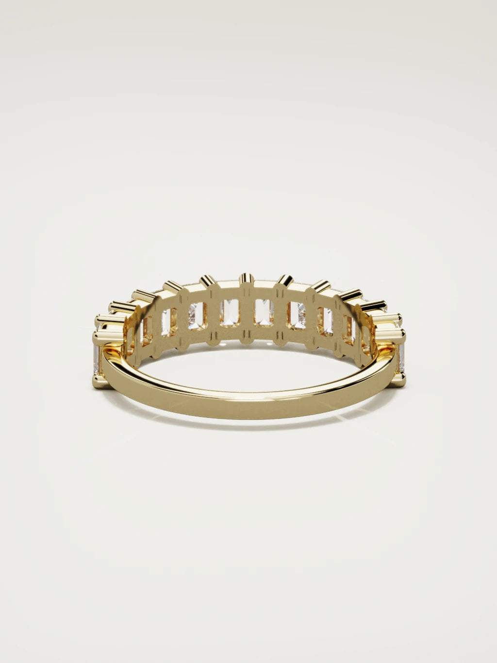The Gracia prong emerald-cut half eternity band in 14K yellow gold, back view