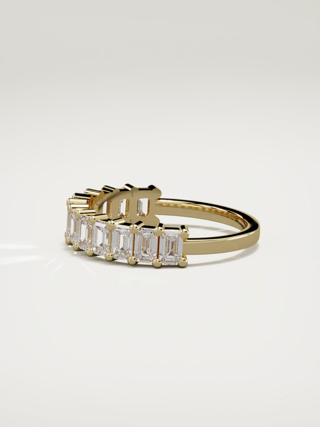 The Gracia prong emerald-cut half eternity band in 14K yellow gold, side view