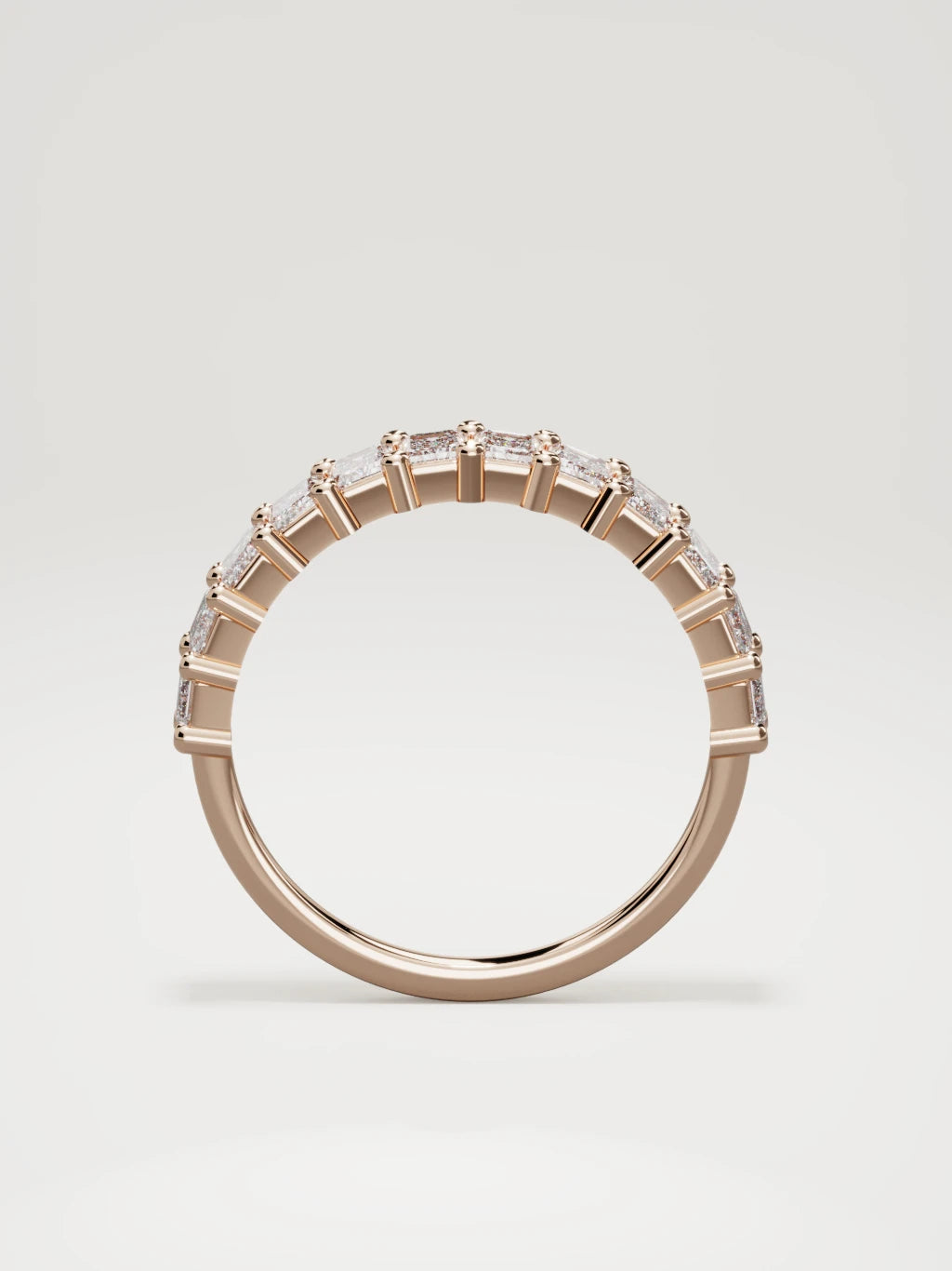 The Gracia prong emerald-cut half eternity band in 14K rose gold, standing front view