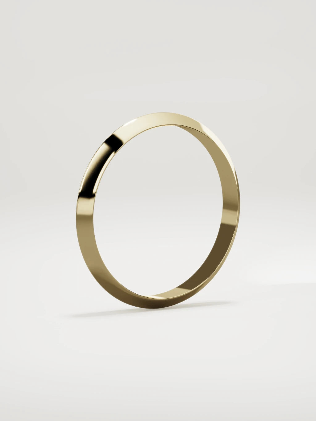 The Filo knife-edge men's wedding band in 14K yellow gold, 3 mm, standing three-quarter view