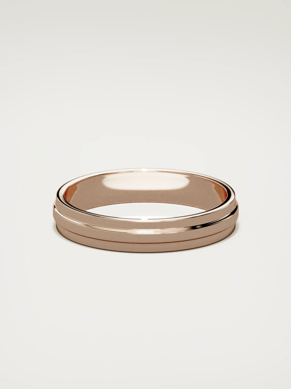 The Linea center-ridge men's wedding band in 14K rose gold, 4 mm, back view