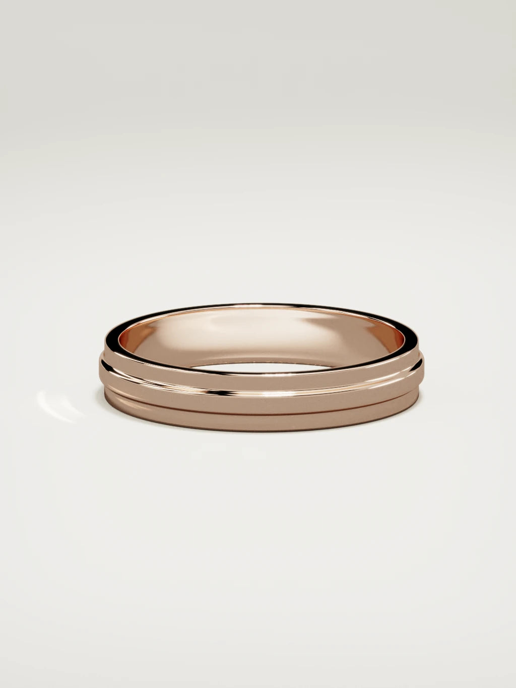 The Linea center-ridge men's wedding band in 14K rose gold, 4 mm, side view
