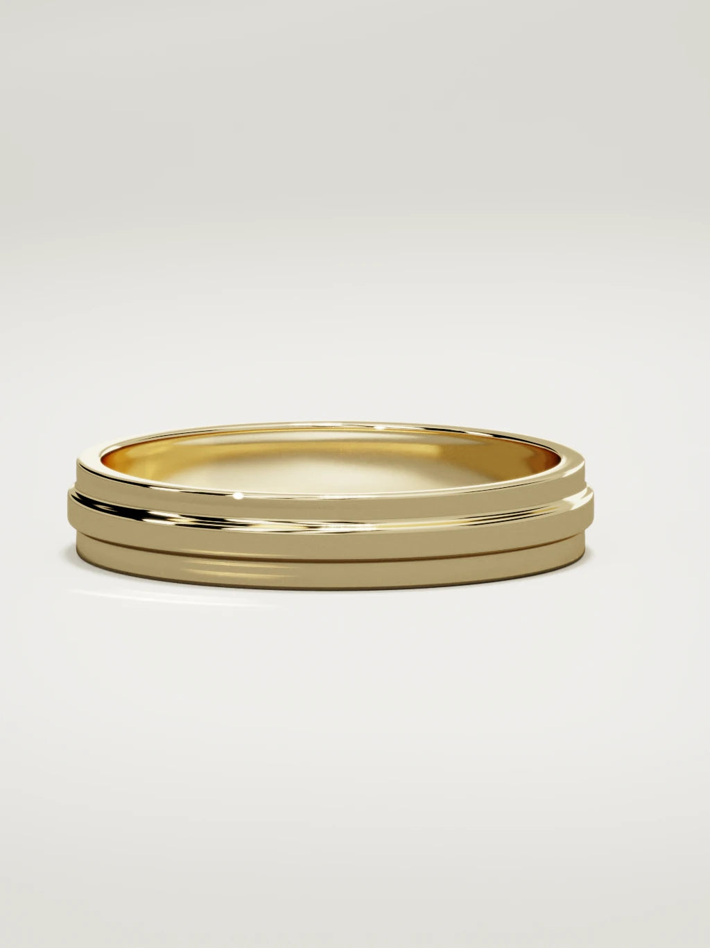 The Linea center-ridge men's wedding band in 14K yellow gold, 4 mm, three-quarter view
