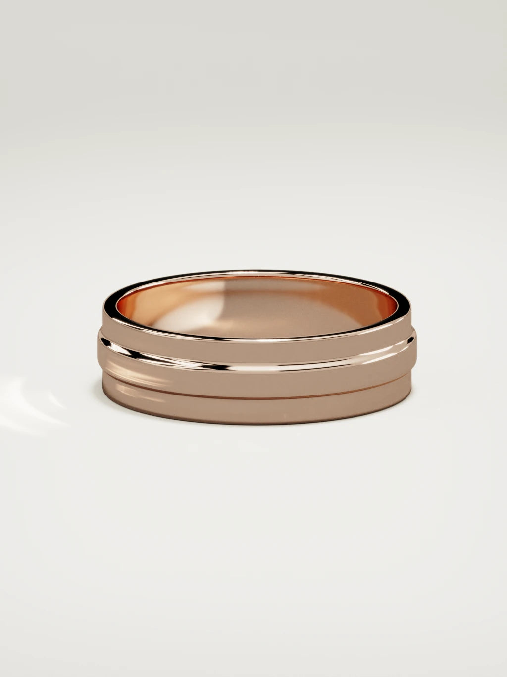 The Linea center-ridge men's wedding band in 14K rose gold, 6 mm, side view