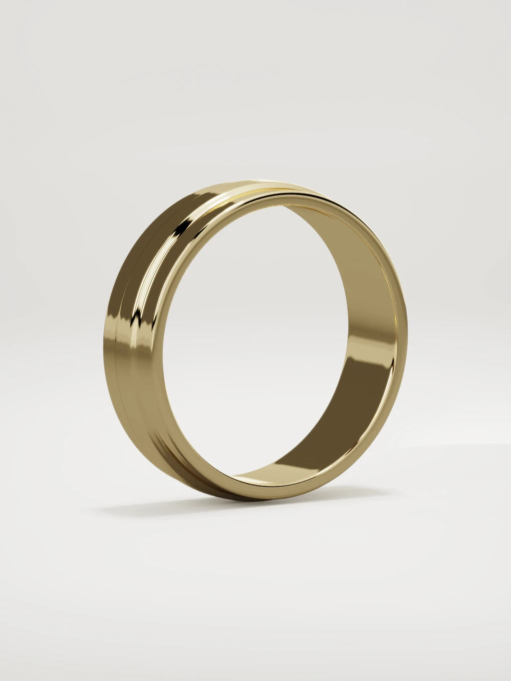 The Linea center-ridge men's wedding band in 14K yellow gold, 6 mm, standing three-quarter view