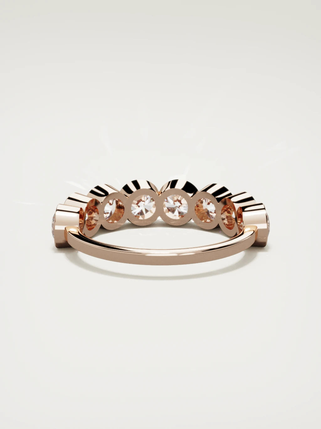 The Lumen large bezel bubble half eternity band in 14K rose gold, back view