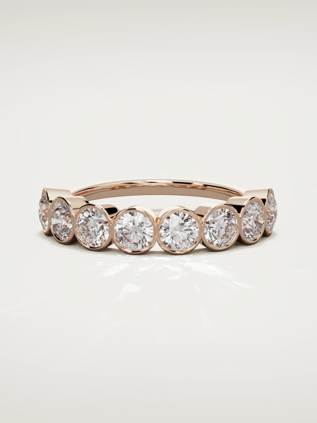 The Lumen large bezel bubble half eternity band in 14K rose gold, front view
