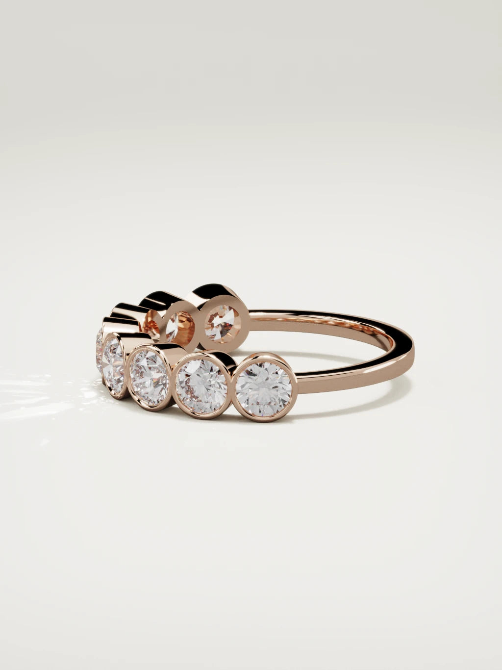 The Lumen large bezel bubble half eternity band in 14K rose gold, side view