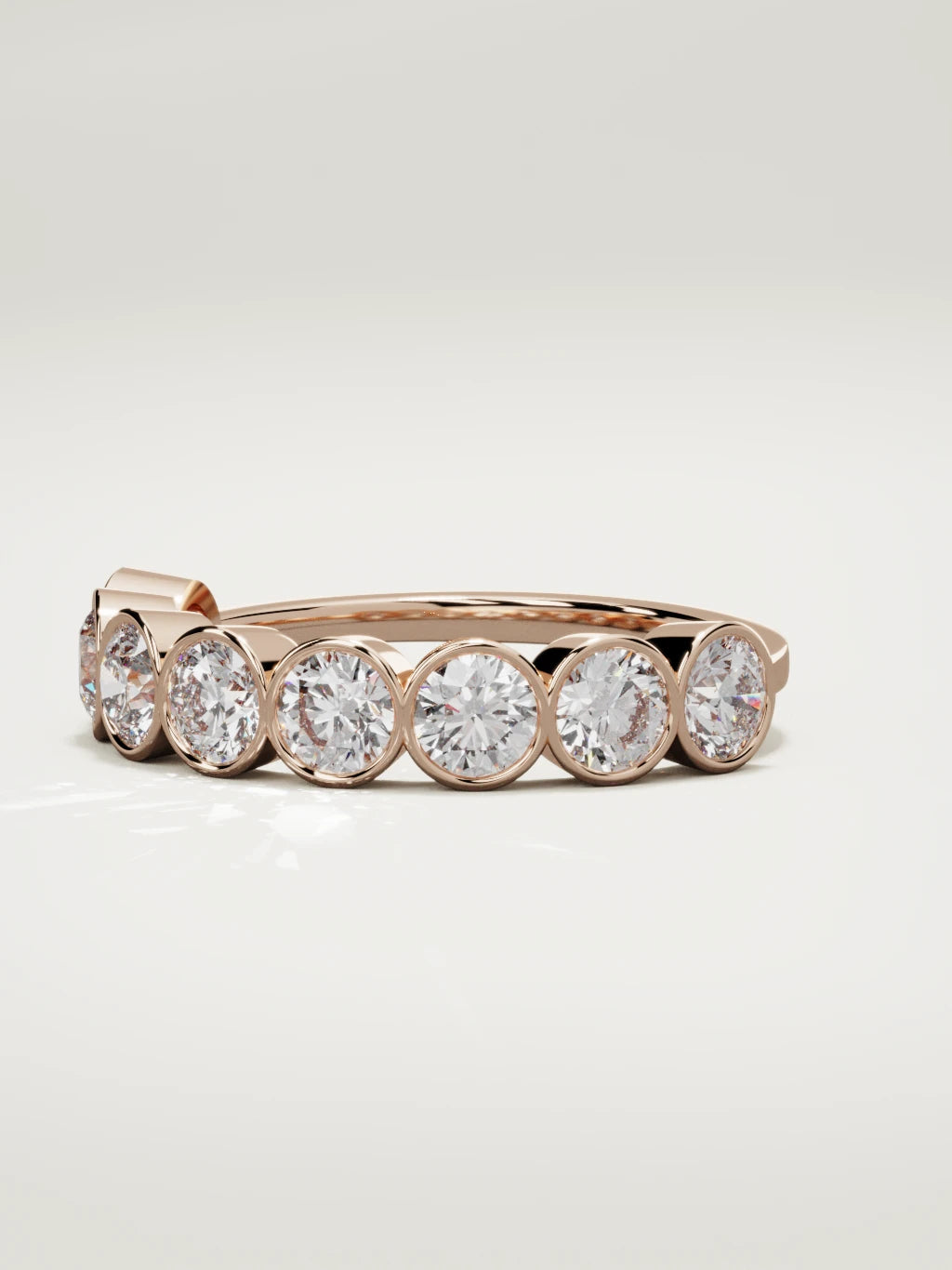 The Lumen large bezel bubble half eternity band in 14K rose gold, three-quarter view