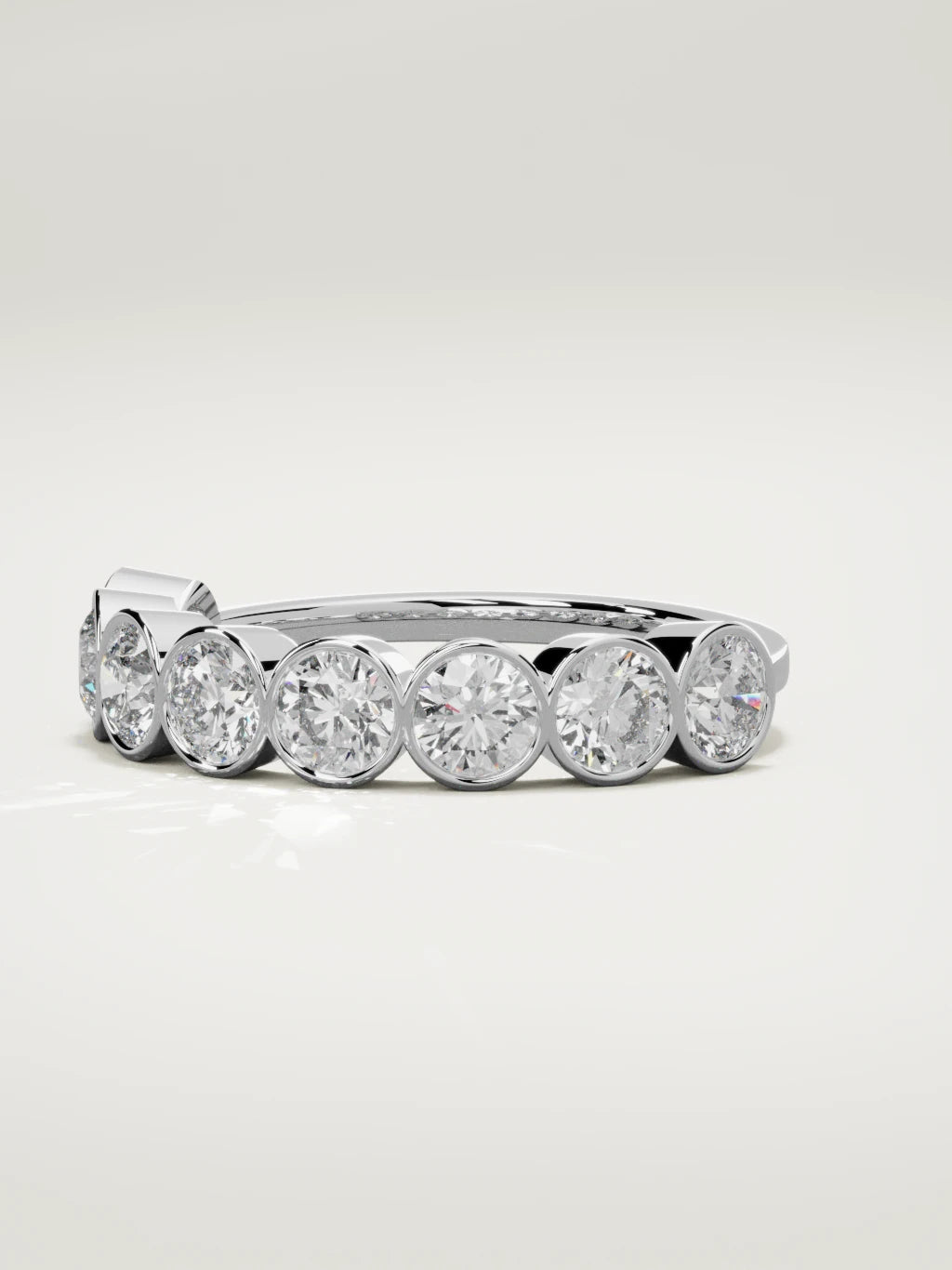 The Lumen large bezel bubble half eternity band in 14K white gold, three-quarter view