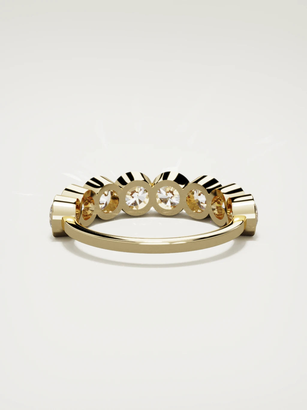 The Lumen large bezel bubble half eternity band in 14K yellow gold, back view