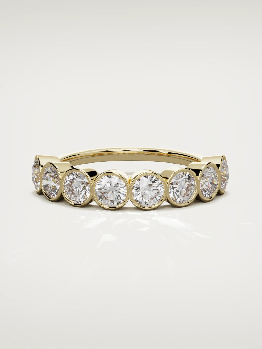 The Lumen large bezel bubble half eternity band in 14K yellow gold, front view