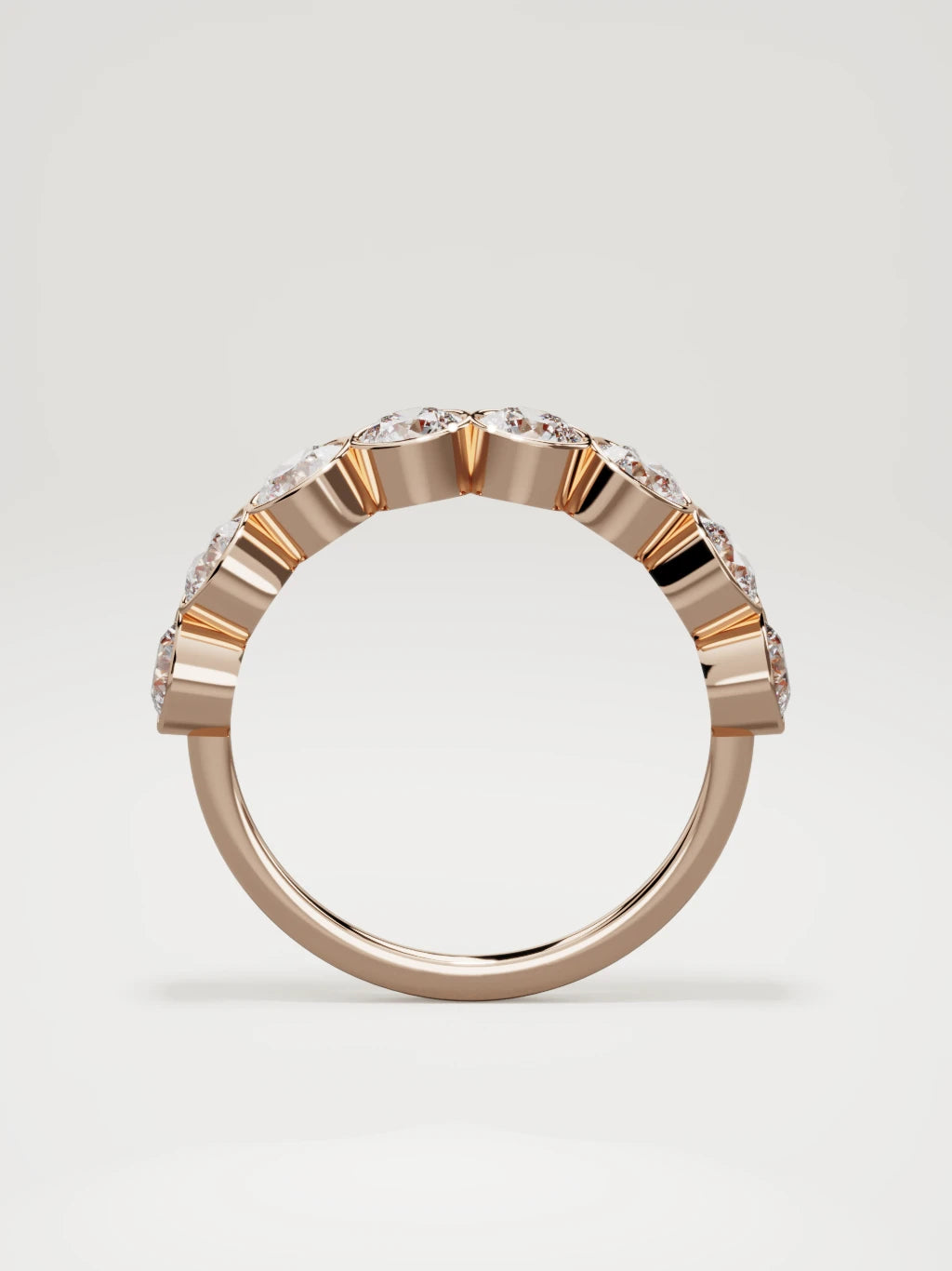 The Lumen large bezel bubble half eternity band in 14K rose gold, standing front view