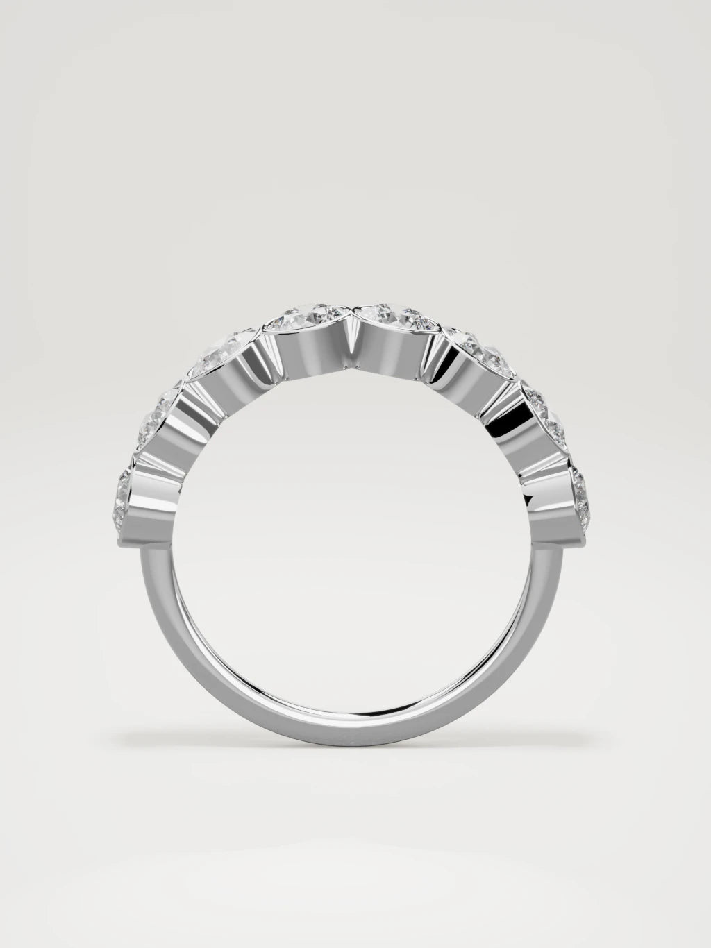 The Lumen large bezel bubble half eternity band in 14K white gold, standing front view