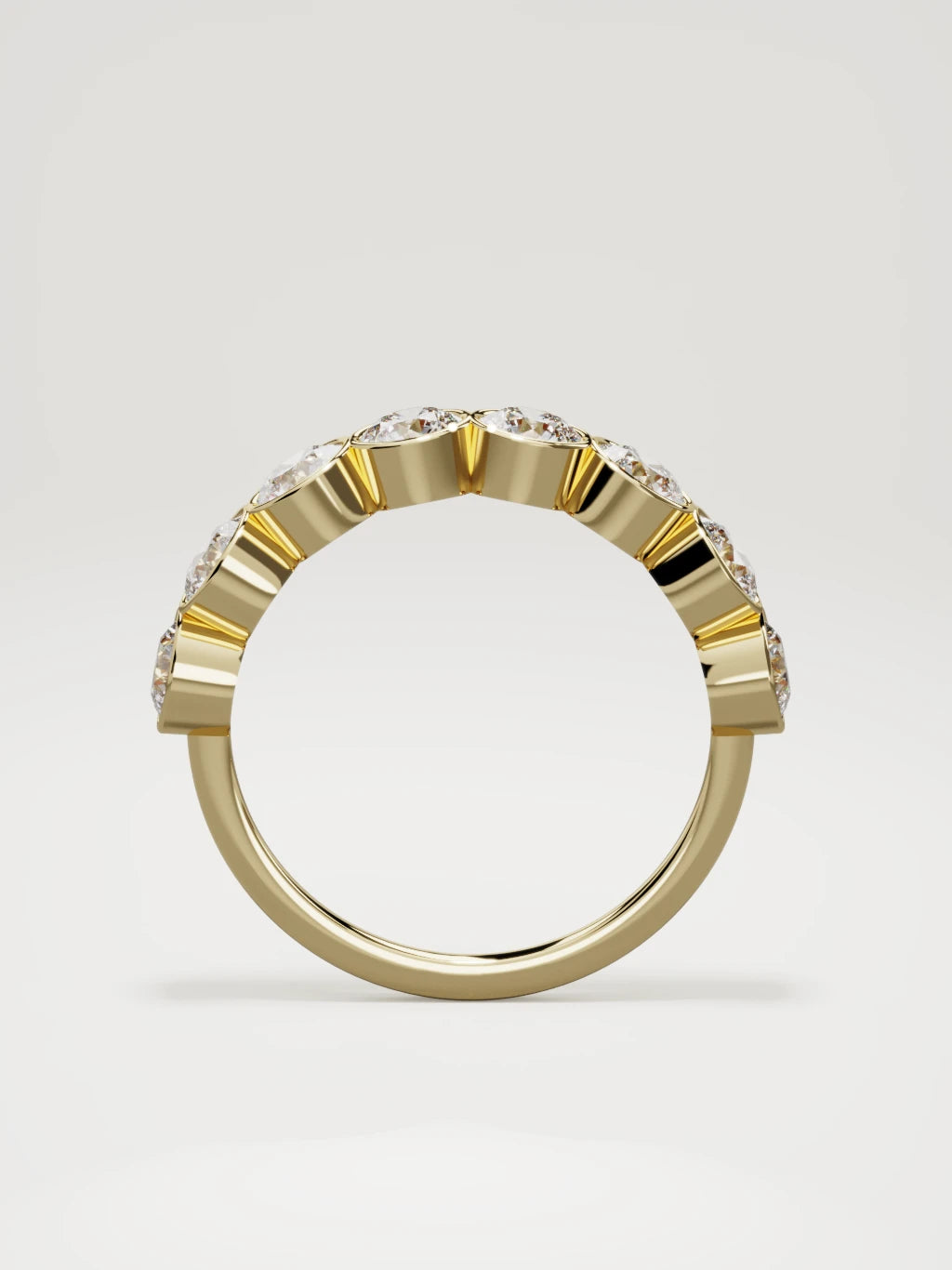 The Lumen large bezel bubble half eternity band in 14K yellow gold, standing front view