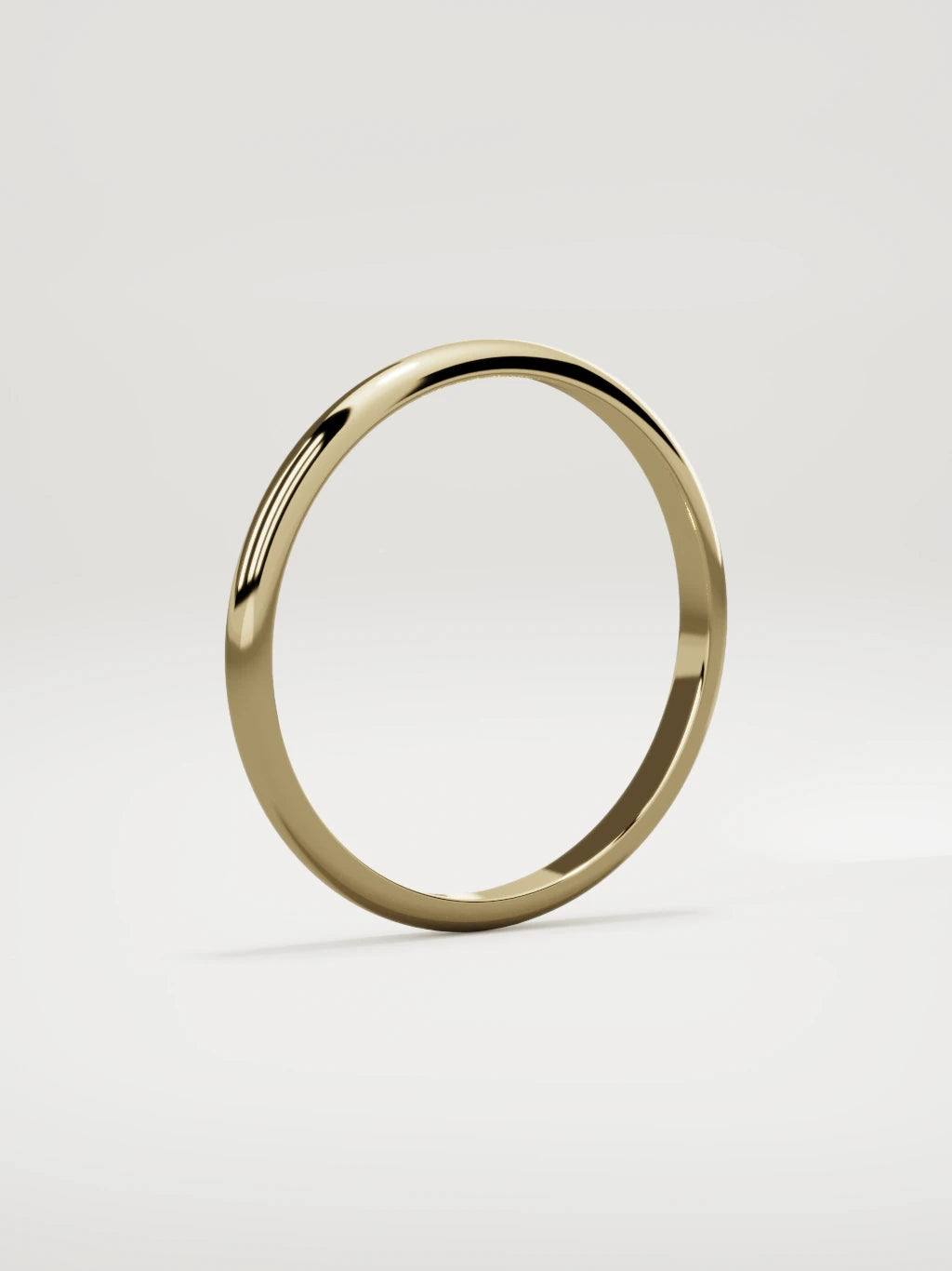 The Domo domed men's wedding band in 14K yellow gold, 2 mm, standing three-quarter view