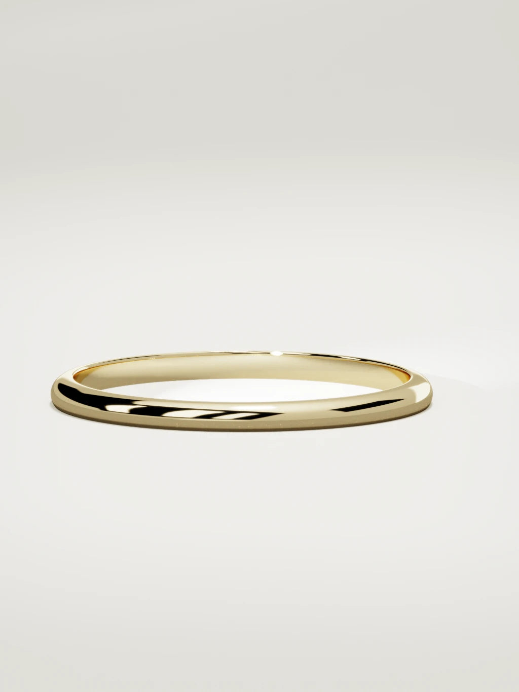 The Domo domed men's wedding band in 14K yellow gold, 2 mm, three-quarter view