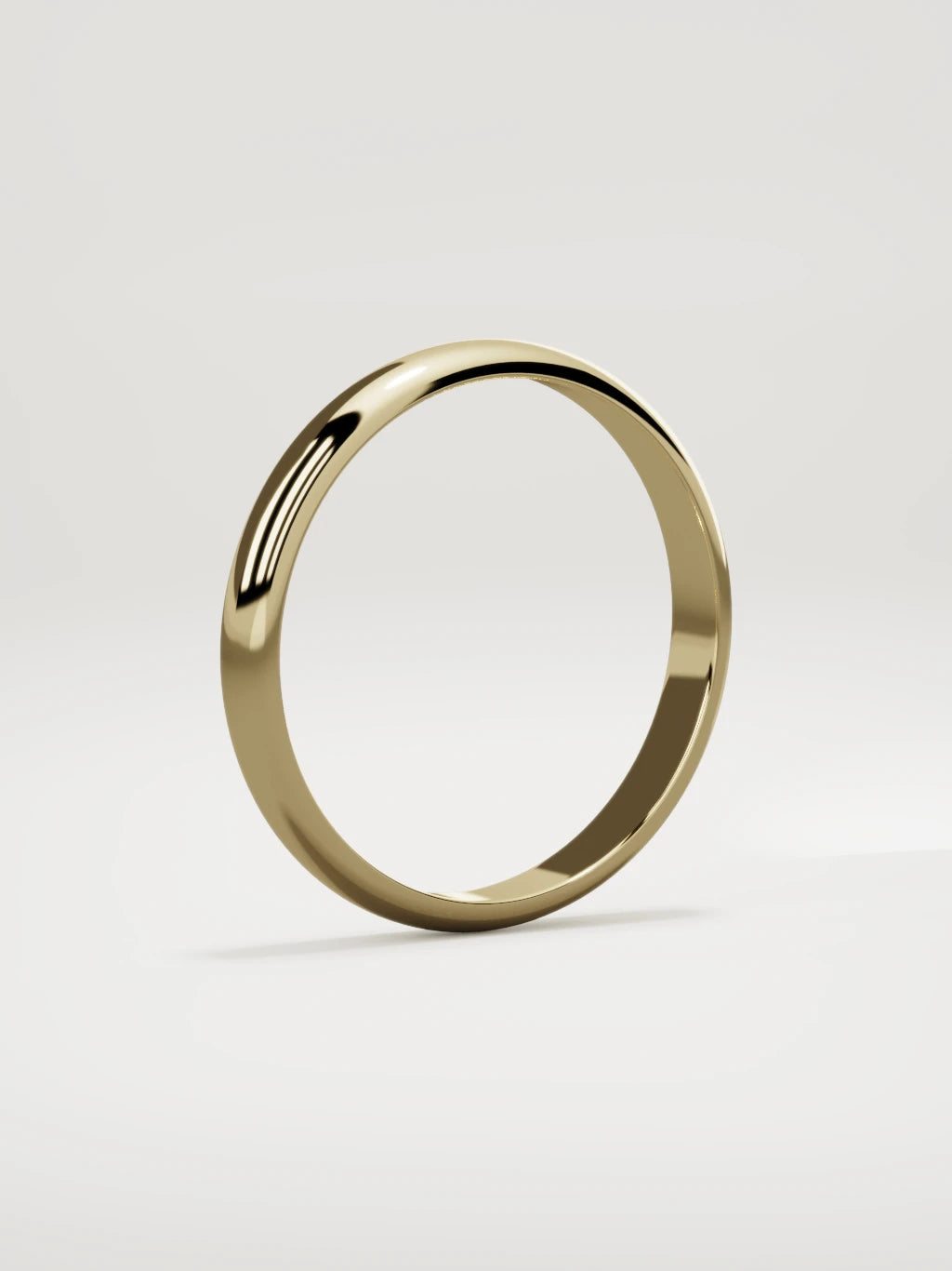 The Domo domed men's wedding band in 14K yellow gold, 3 mm, standing three-quarter view