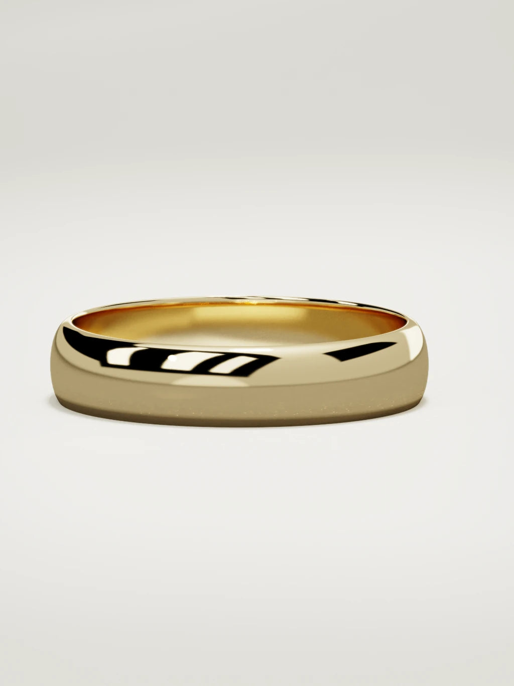 The Domo domed men's wedding band in 14K yellow gold, 5 mm, three-quarter view