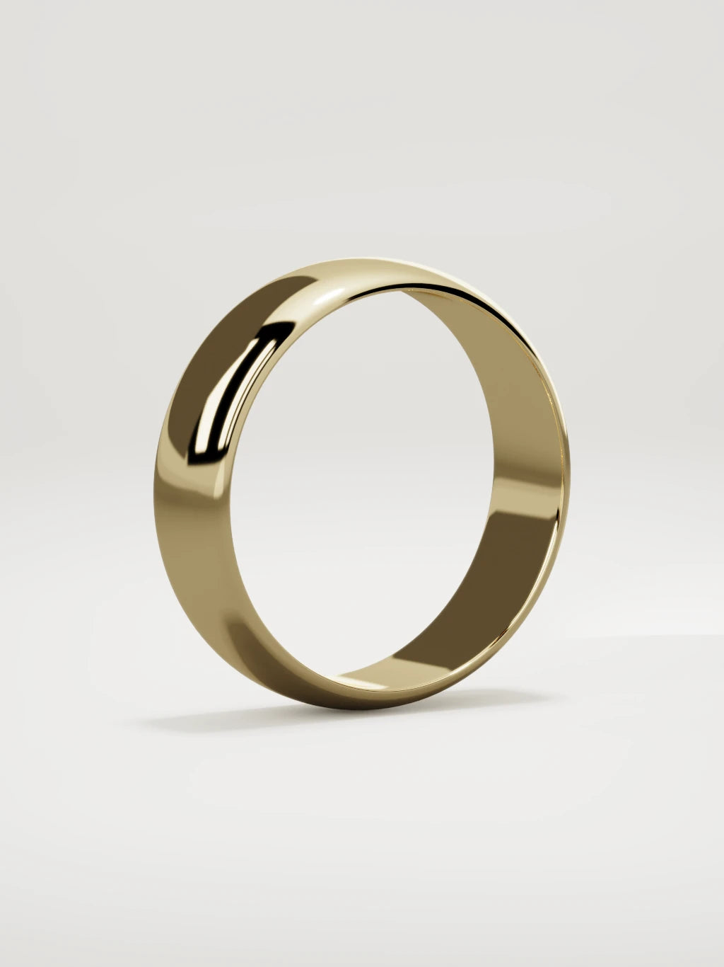 The Domo domed men's wedding band in 14K yellow gold, 6 mm, standing three-quarter view