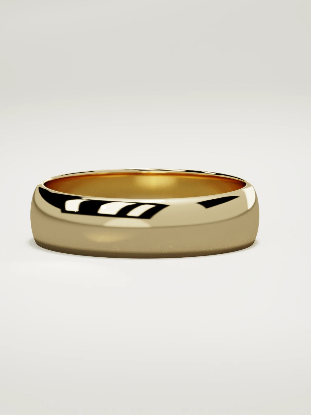 The Domo domed men's wedding band in 14K yellow gold, 6 mm, three-quarter view