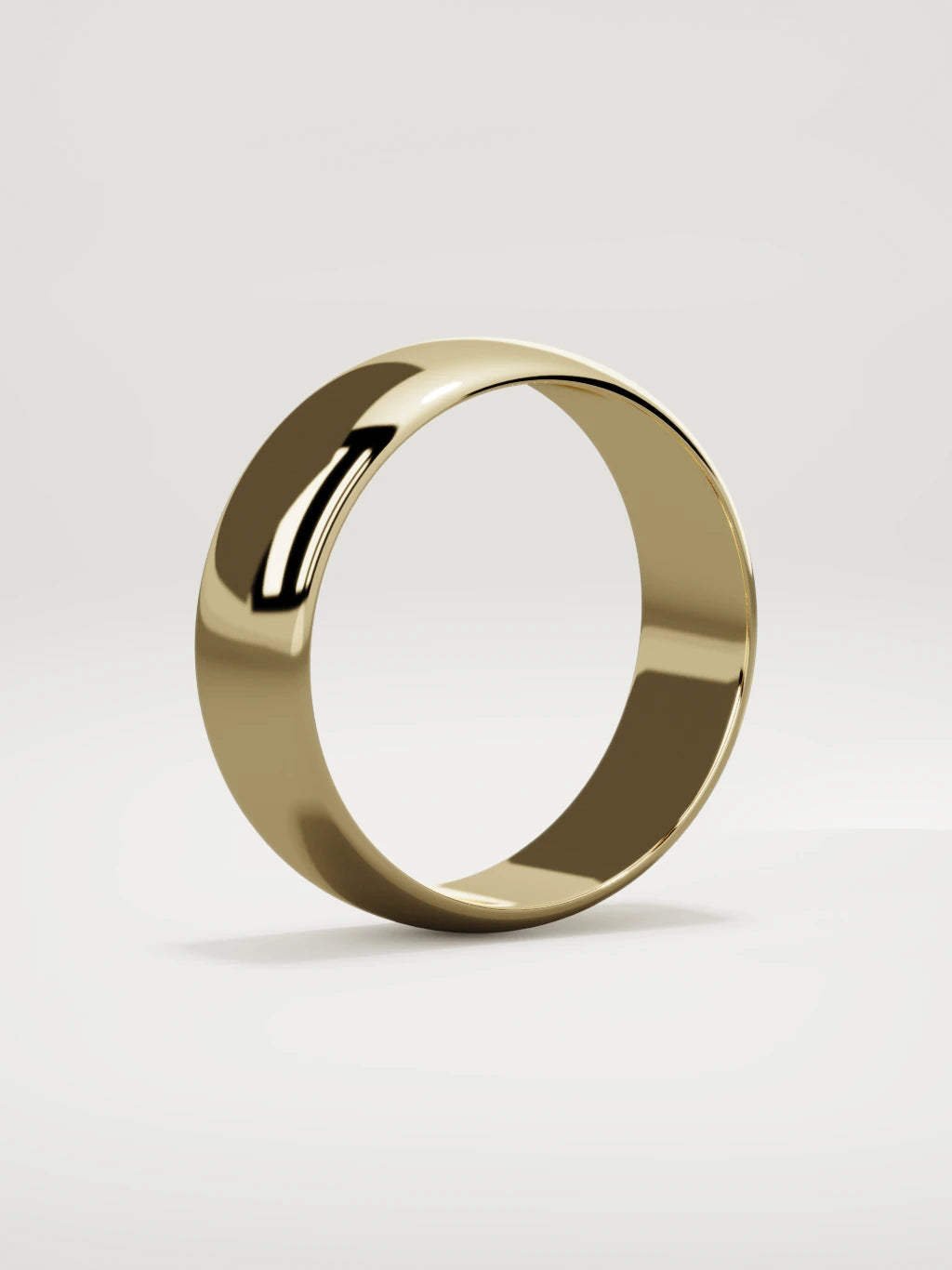 The Domo domed men's wedding band in 14K yellow gold, 7 mm, standing three-quarter view