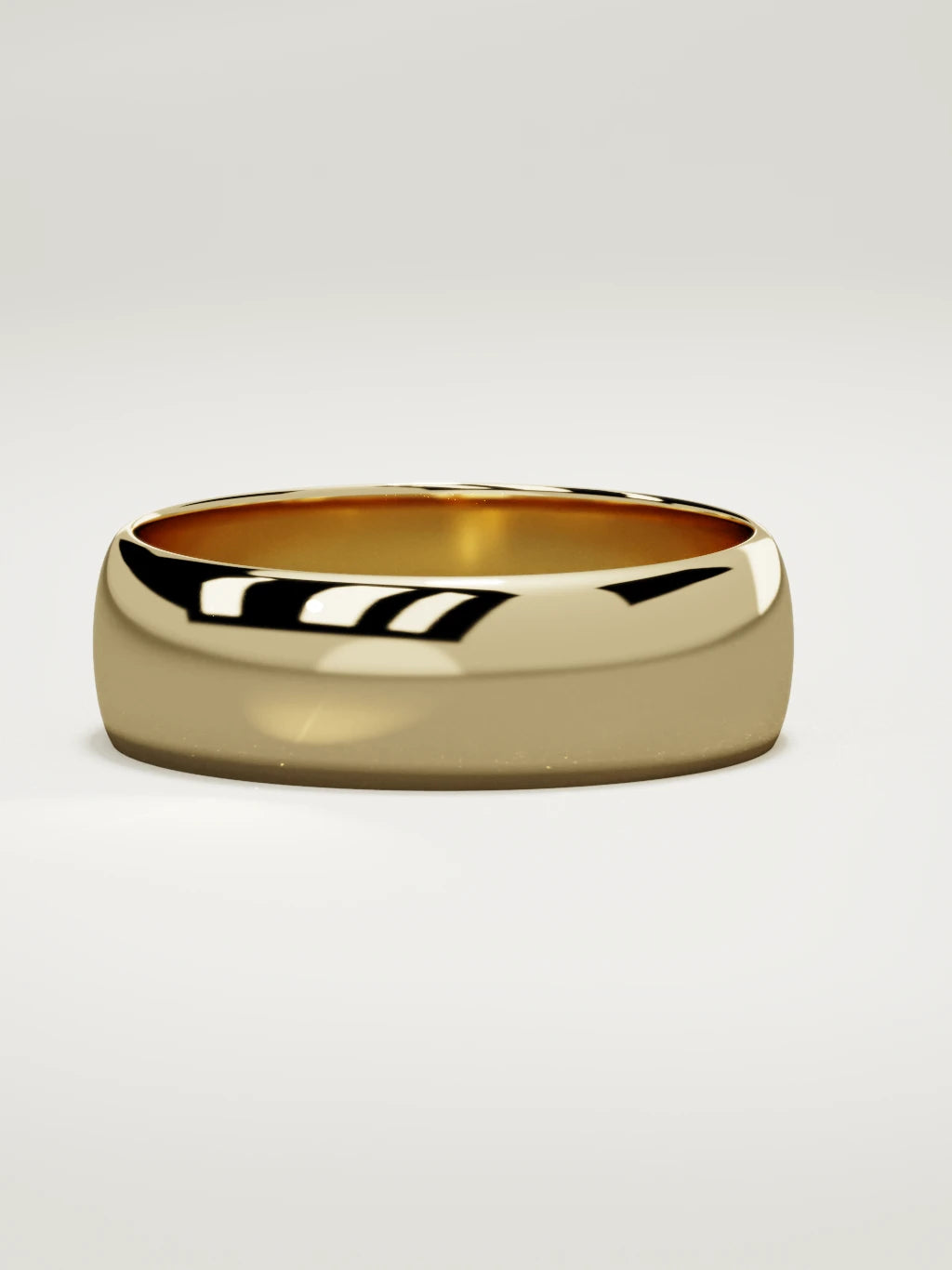 The Domo domed men's wedding band in 14K yellow gold, 7 mm, three-quarter view