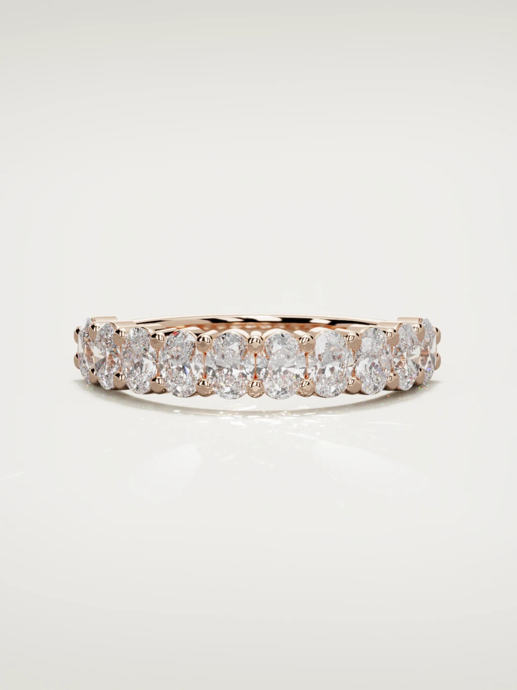 The Musa north-south oval half eternity band in 14K rose gold, front view