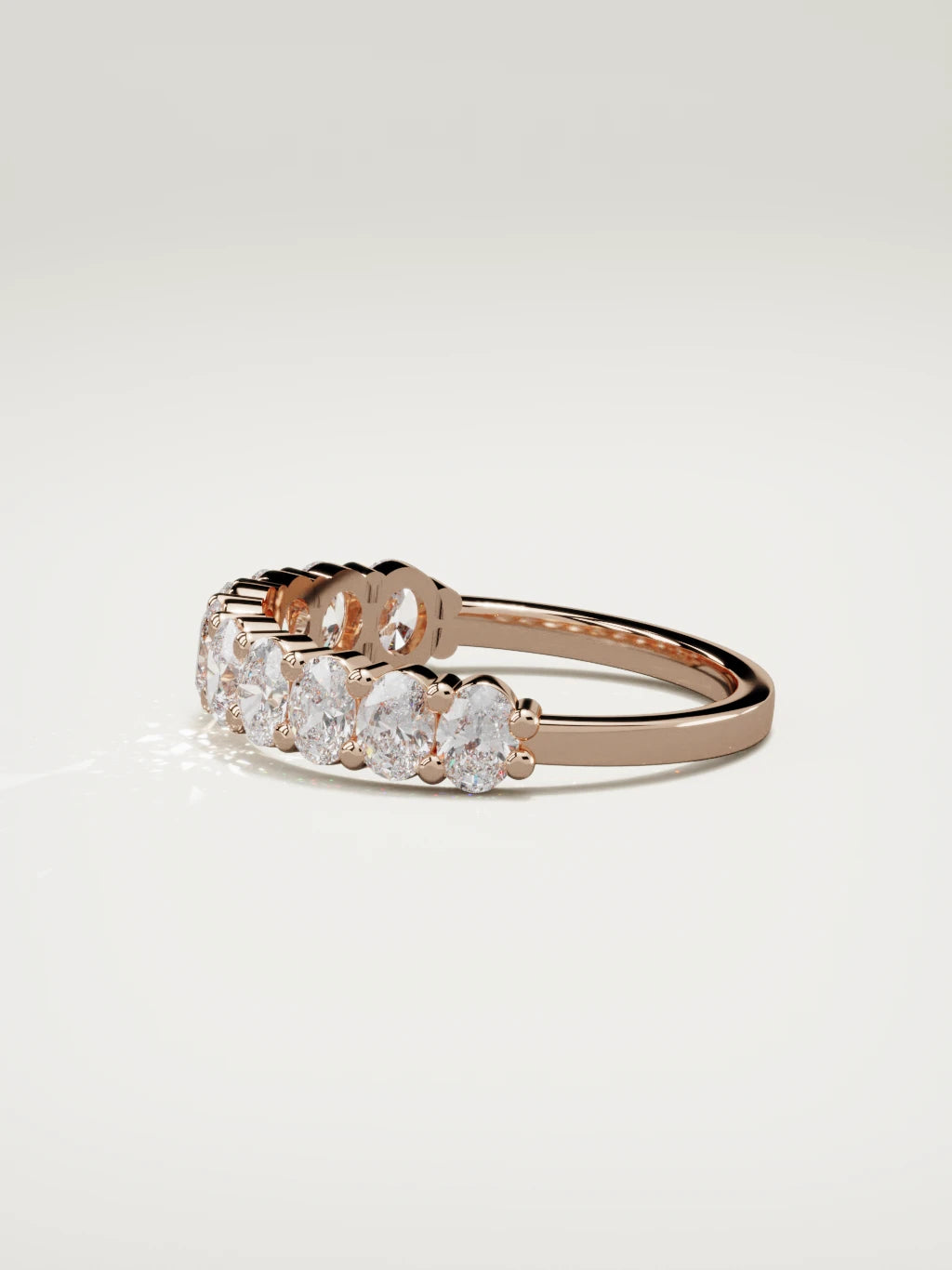 The Musa north-south oval half eternity band in 14K rose gold, side view