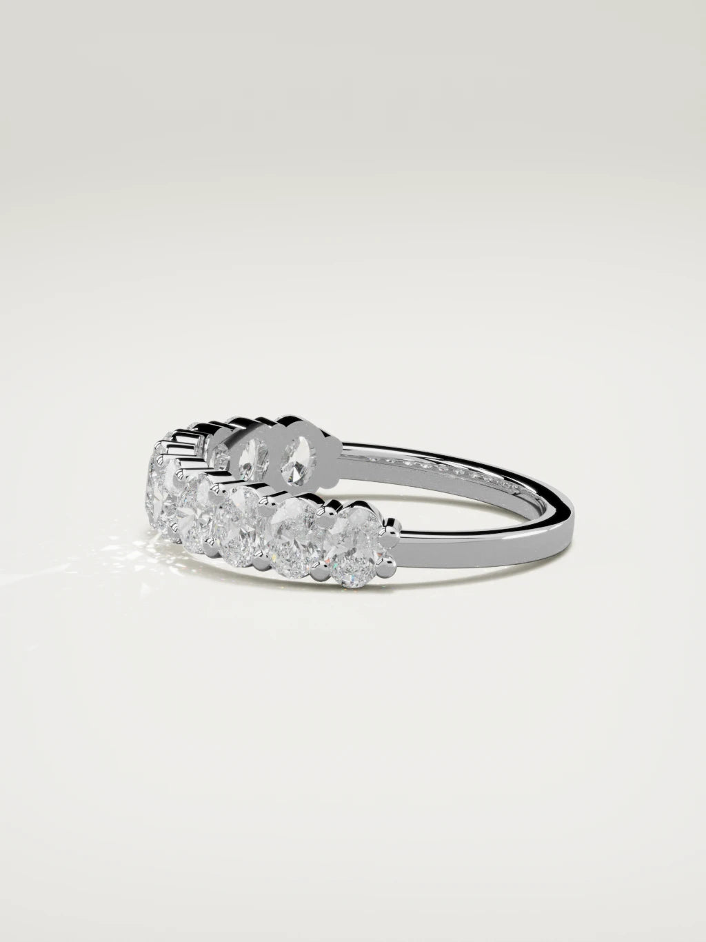 The Musa north-south oval half eternity band in 14K white gold, side view