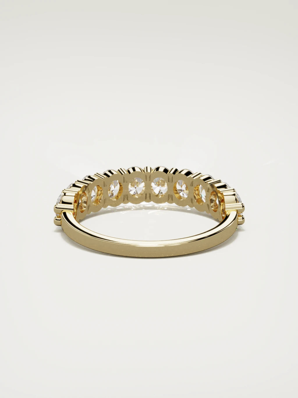 The Musa north-south oval half eternity band in 14K yellow gold, back view