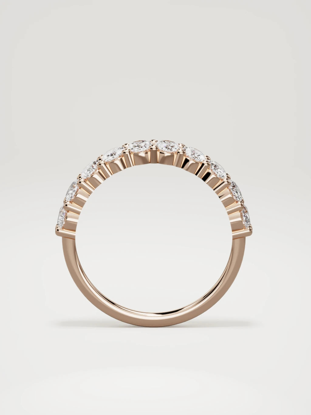 The Musa north-south oval half eternity band in 14K rose gold, standing front view