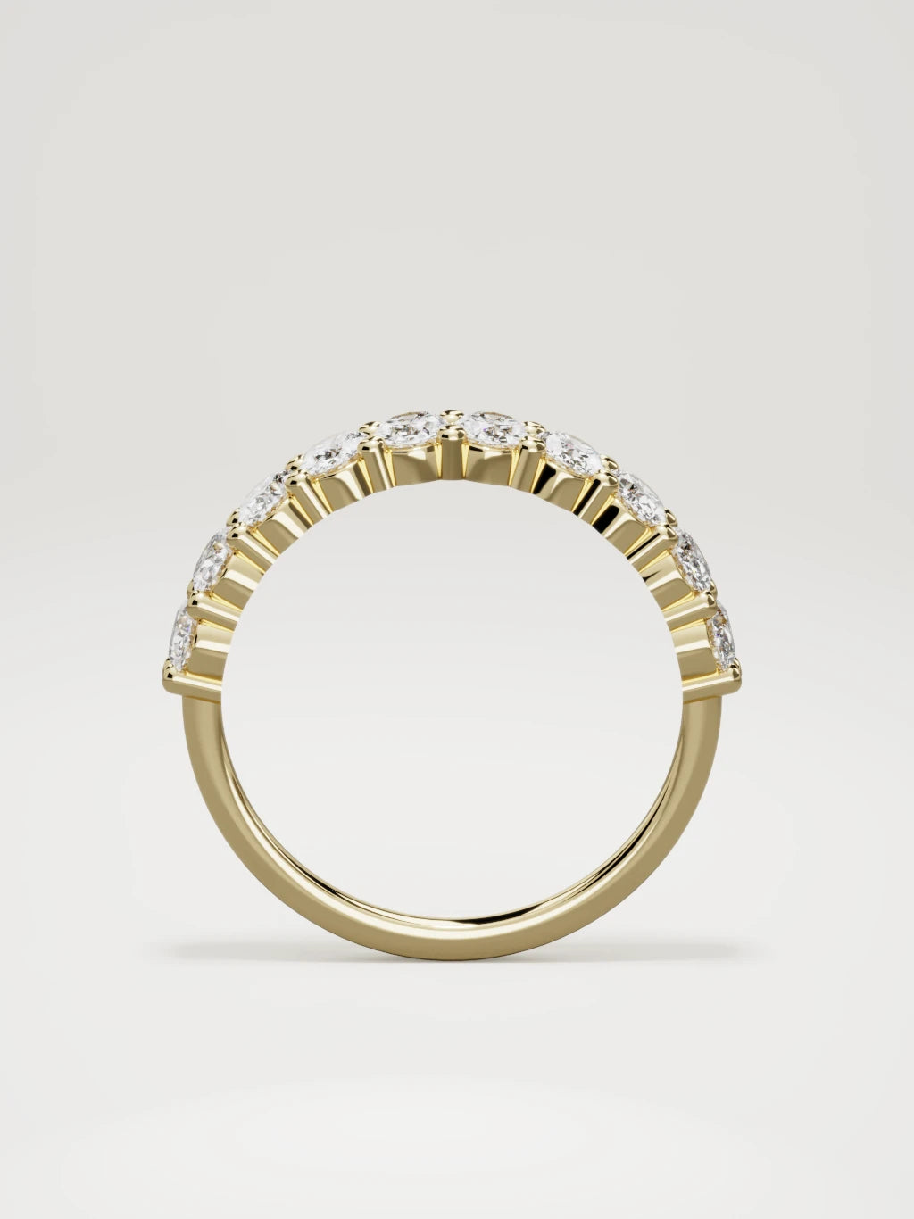 The Musa north-south oval half eternity band in 14K yellow gold, standing front view
