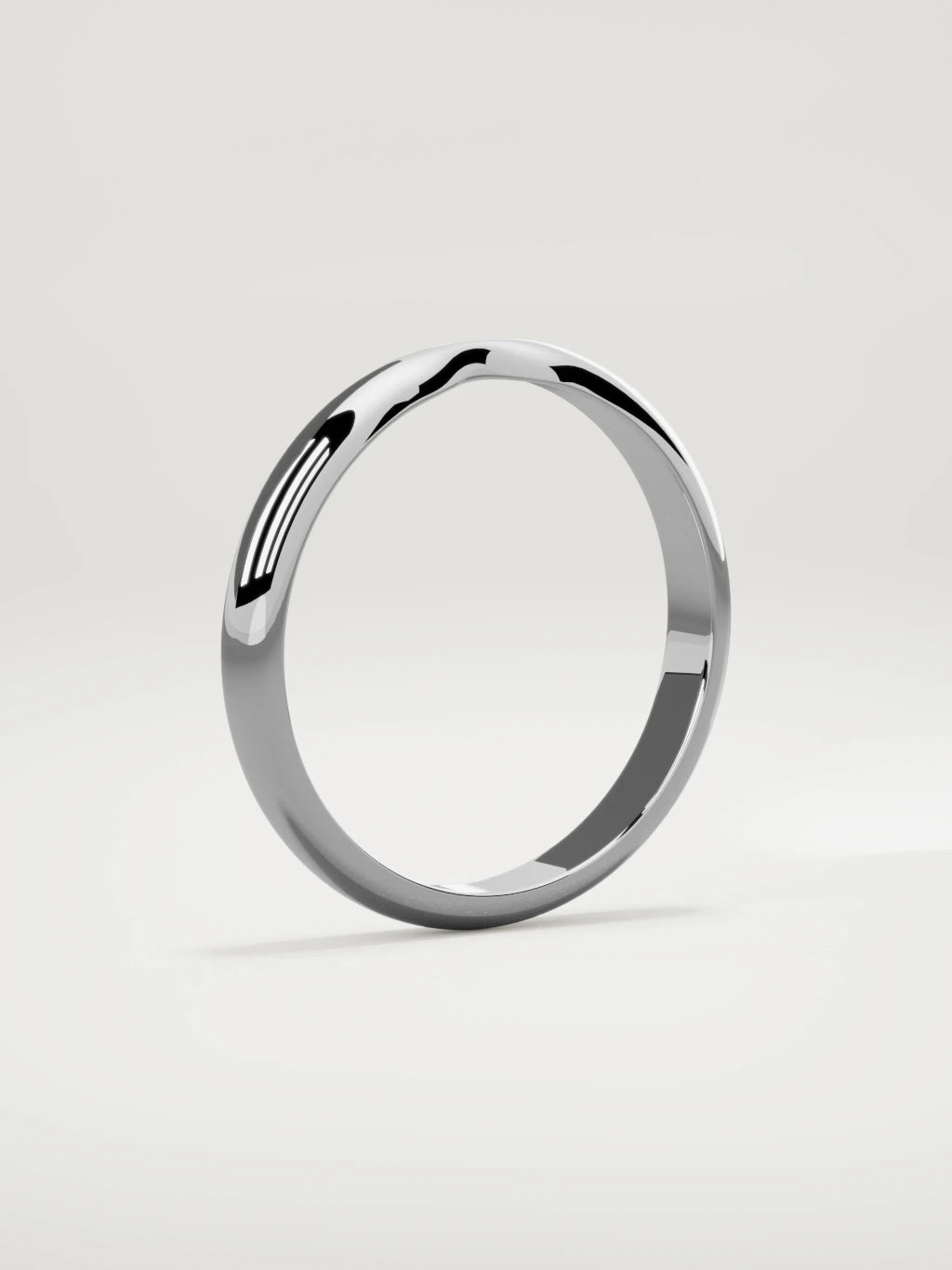 The Nido notched contour wedding band in 14K white gold, standing three-quarter view