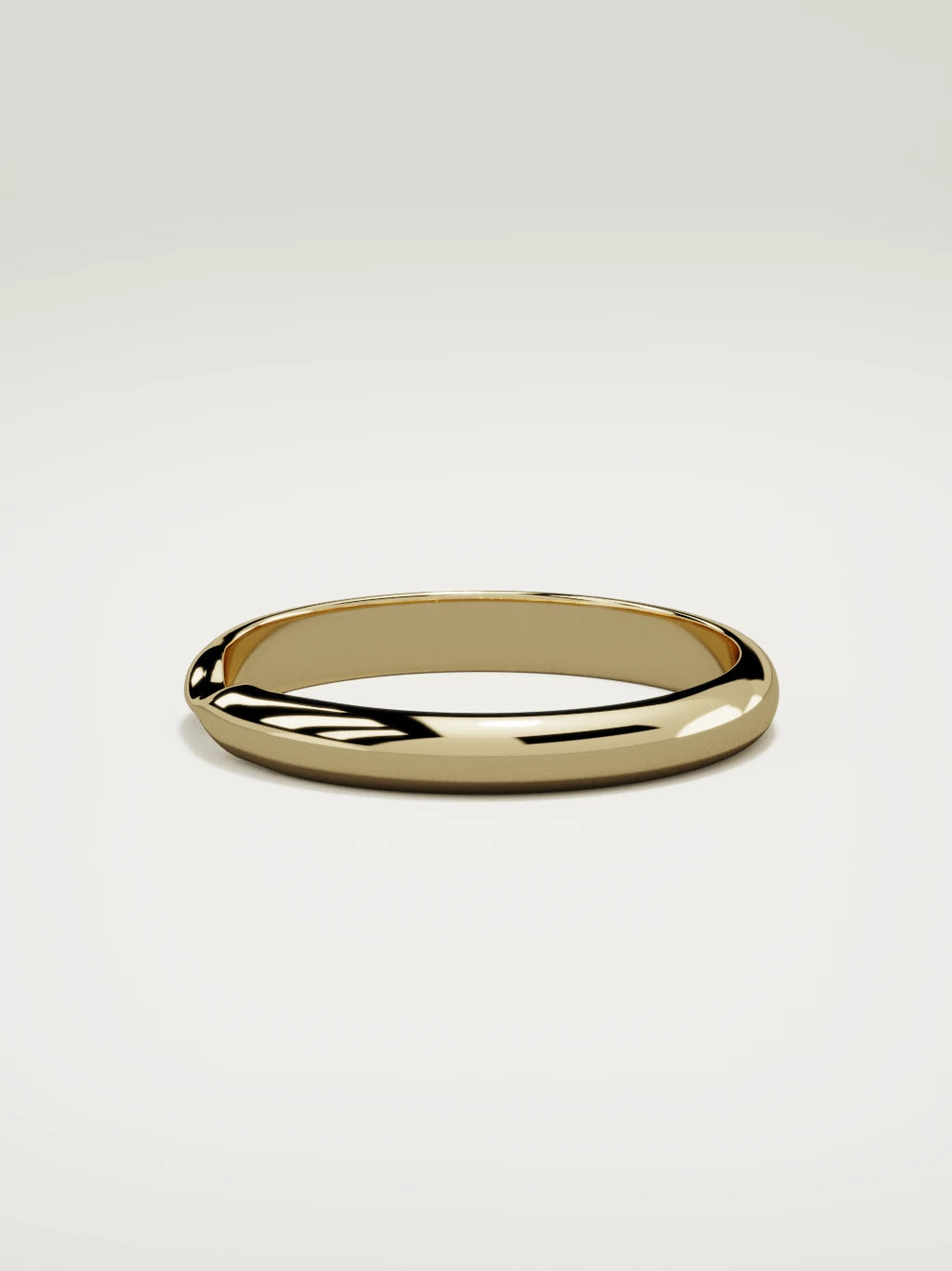 The Nido notched contour wedding band in 14K yellow gold, side view