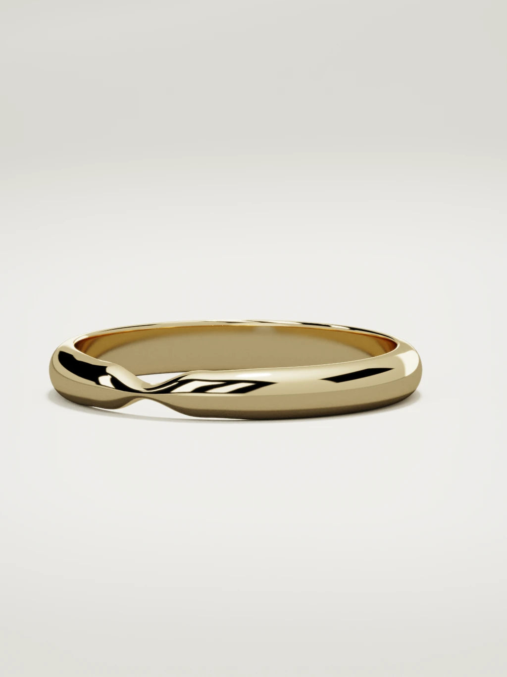 The Nido notched contour wedding band in 14K yellow gold, three-quarter view