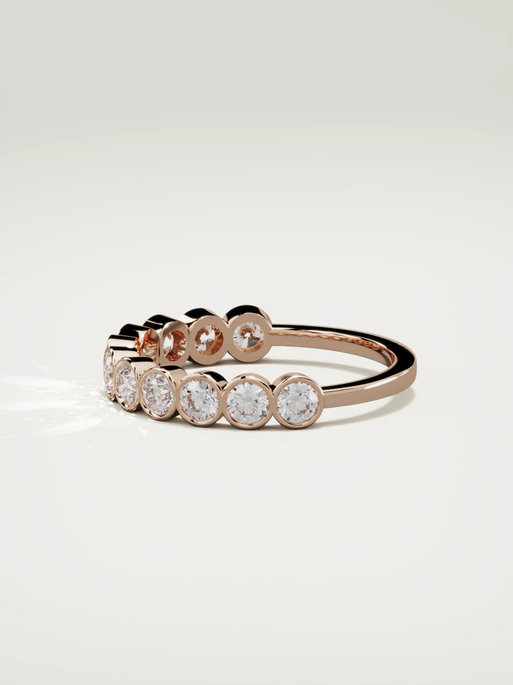 The Perla bezel bubble half eternity band in 14K rose gold, side view