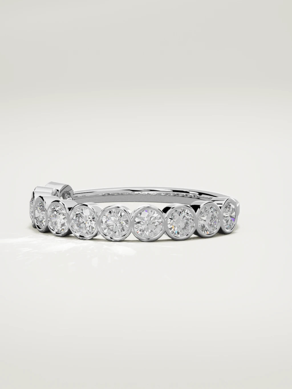 The Perla bezel bubble half eternity band in 14K white gold, three-quarter view