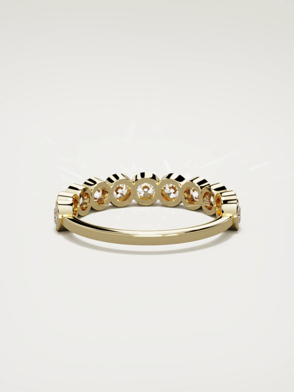 The Perla bezel bubble half eternity band in 14K yellow gold, back view