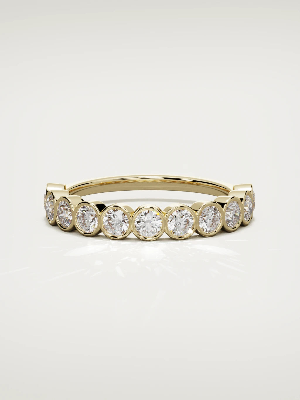 The Perla bezel bubble half eternity band in 14K yellow gold, front view