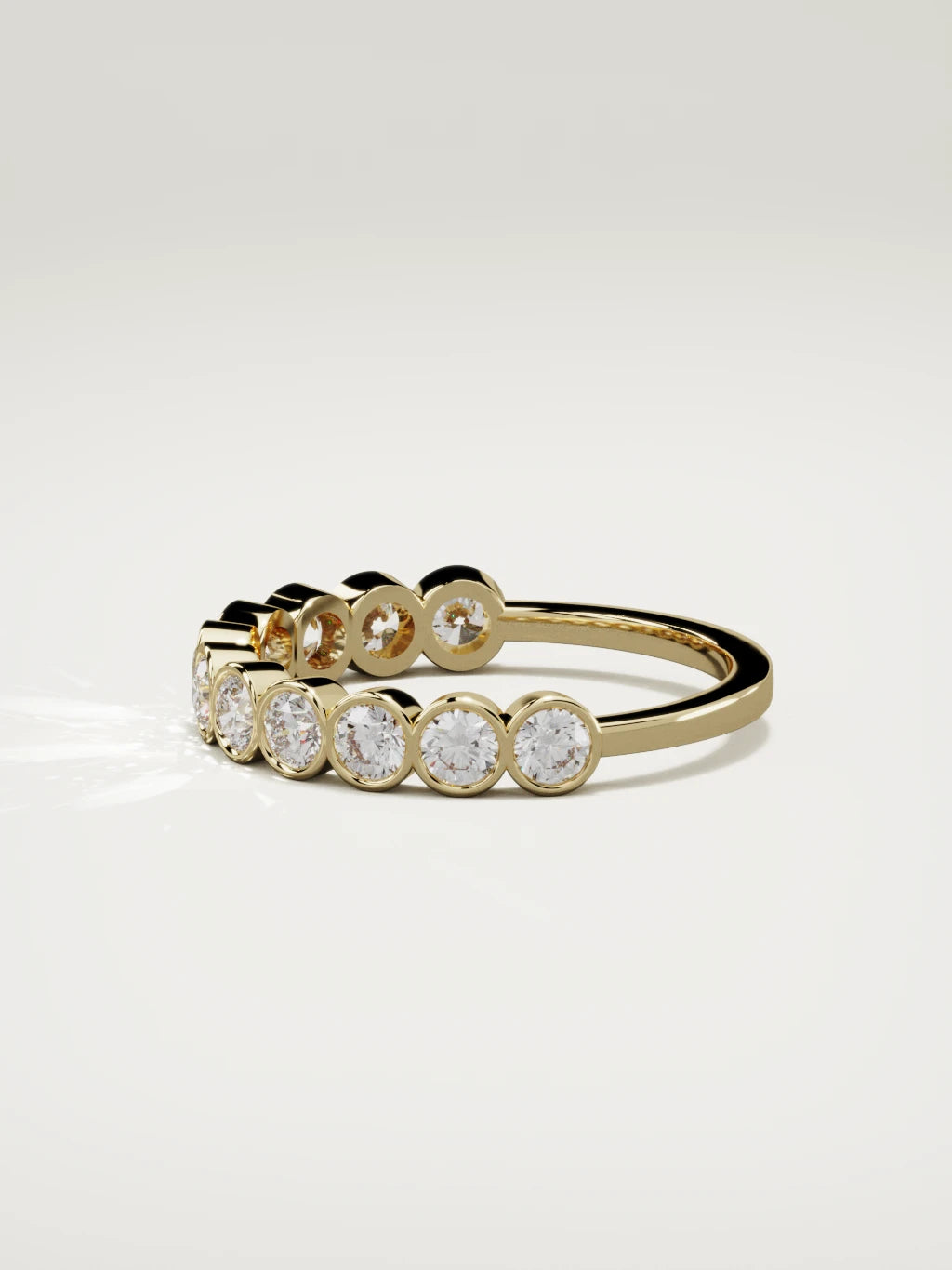 The Perla bezel bubble half eternity band in 14K yellow gold, side view