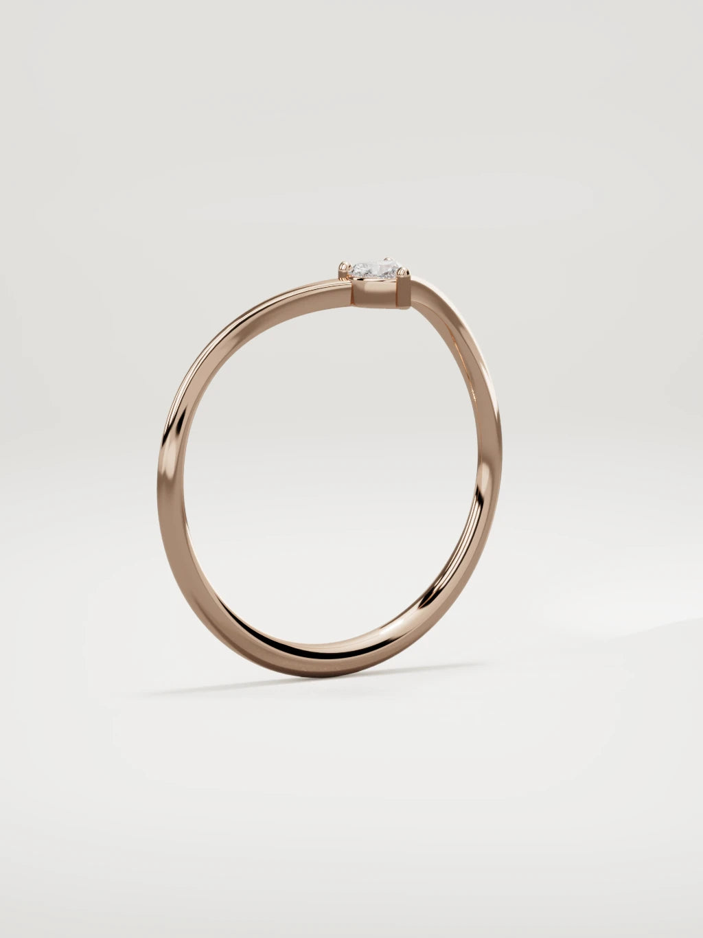 The Pico chevron heart diamond band in 14K rose gold, standing three-quarter view