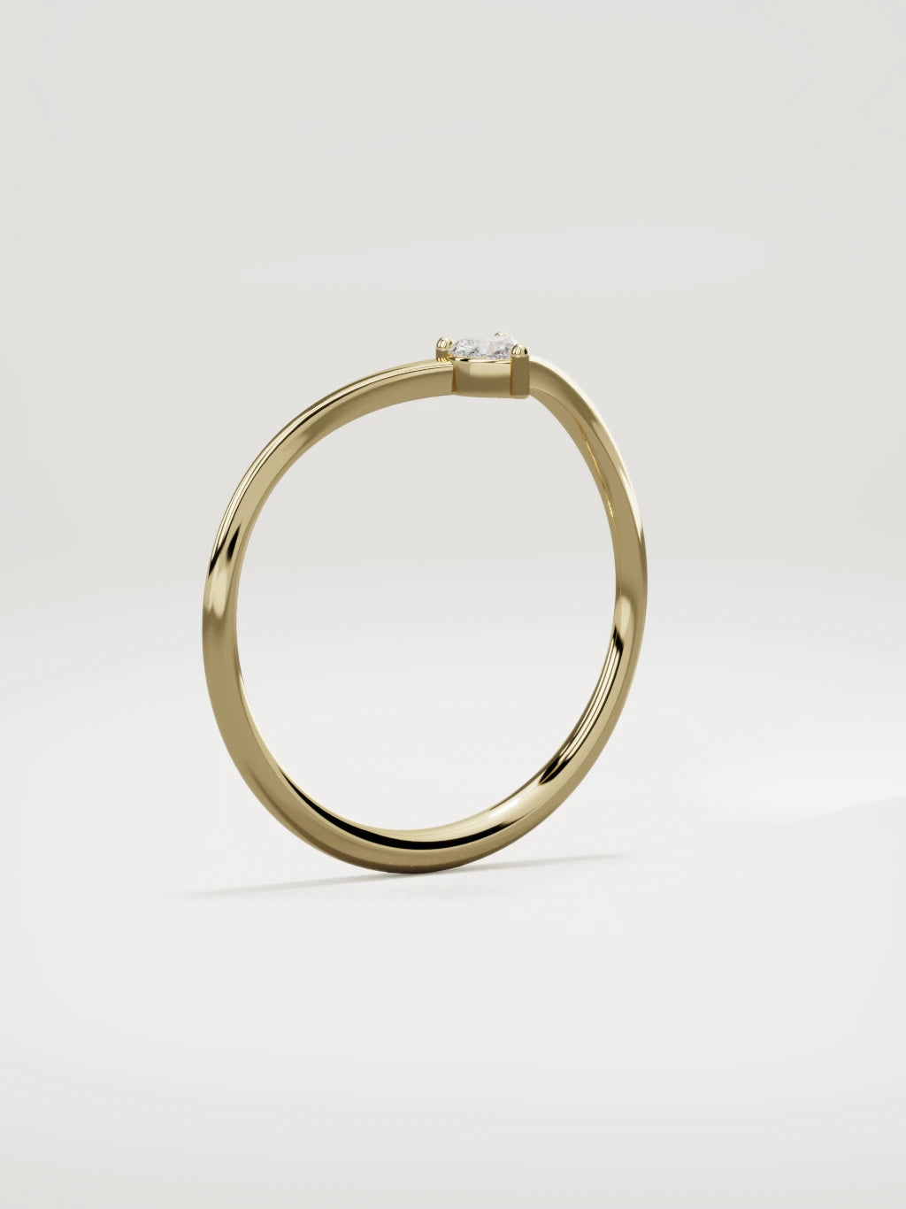 The Pico chevron heart diamond band in 14K yellow gold, standing three-quarter view