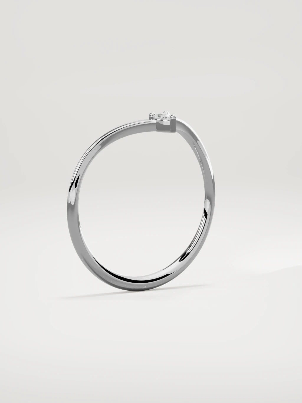 The Pico chevron pear diamond band in 14K white gold, standing three-quarter view