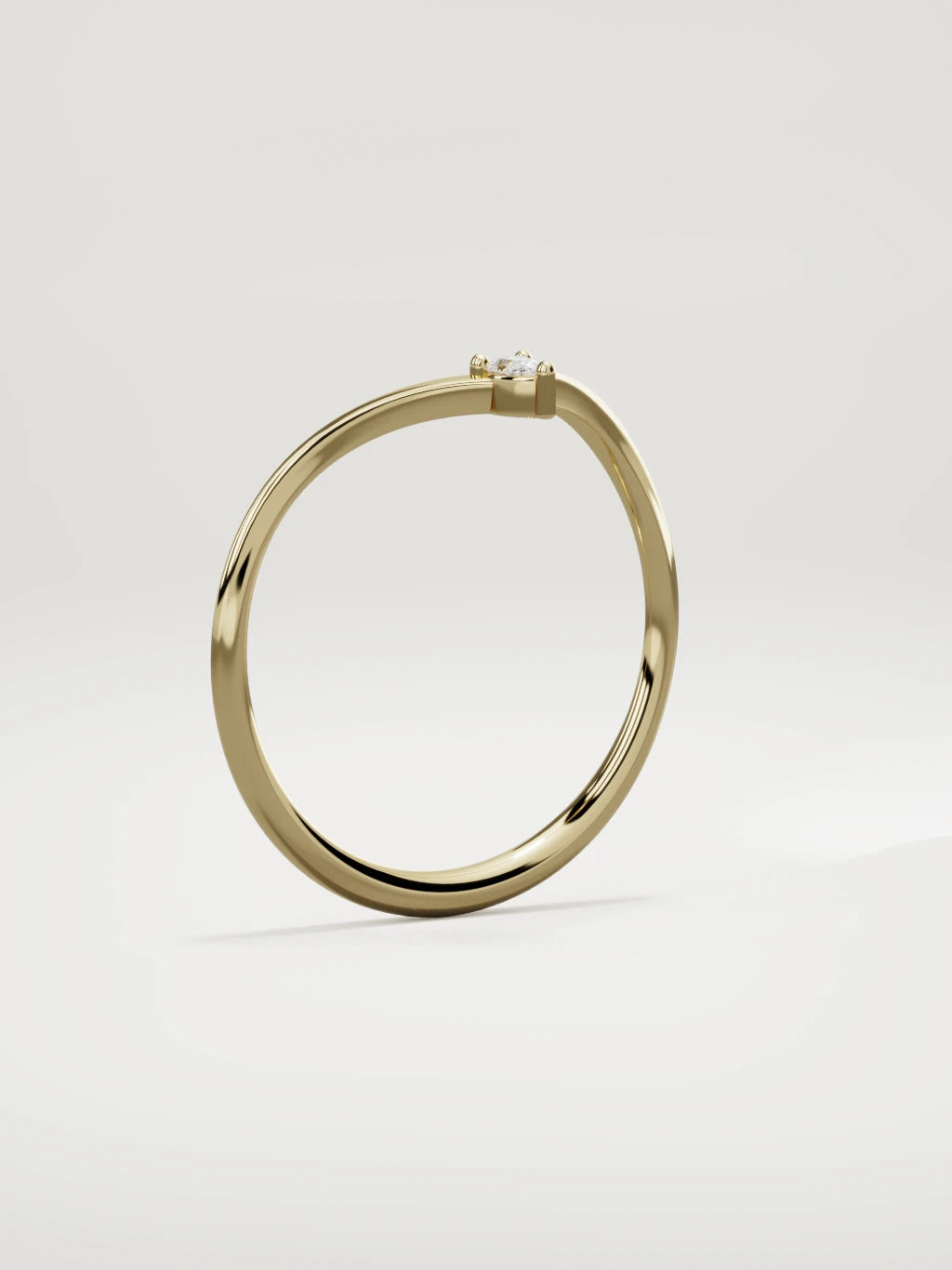 The Pico chevron pear diamond band in 14K yellow gold, standing three-quarter view