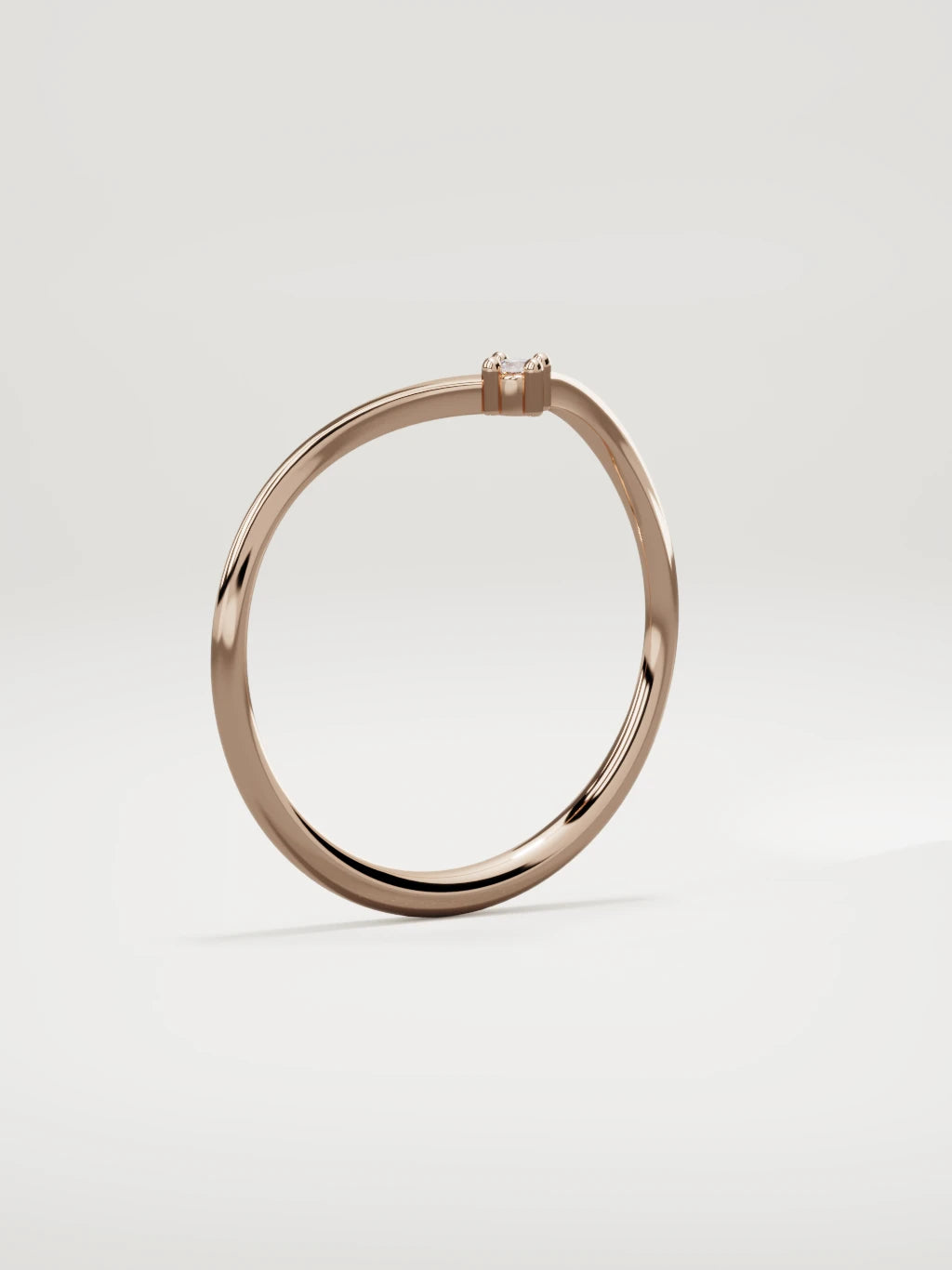 The Pico chevron round diamond band in 14K rose gold, standing three-quarter view