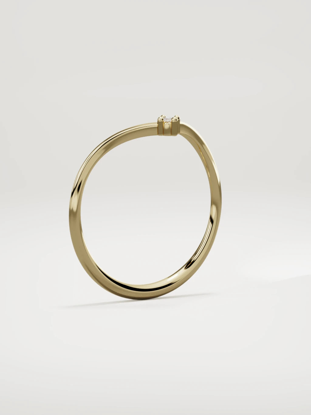 The Pico chevron round diamond band in 14K yellow gold, standing three-quarter view